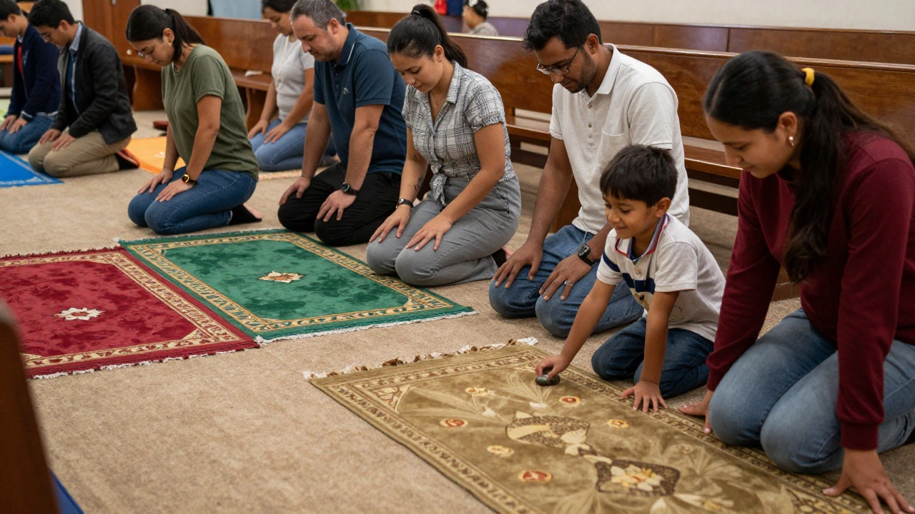 A group of people of all ages kneeling on colorful plain prayer rugs in a church hall.