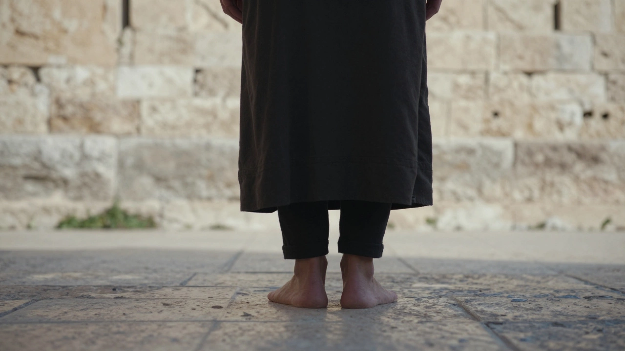 A person standing on a stone floor praying toward Jerusalem.