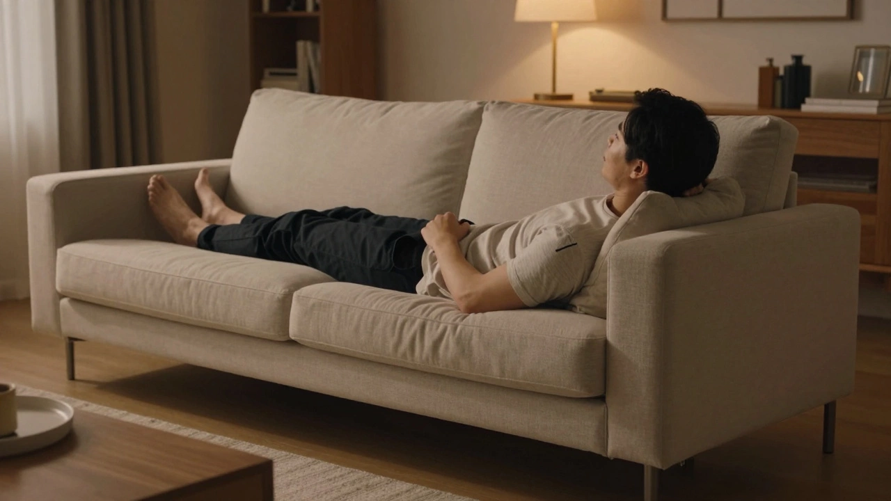 Person testing sofa firmness by leaning back fully