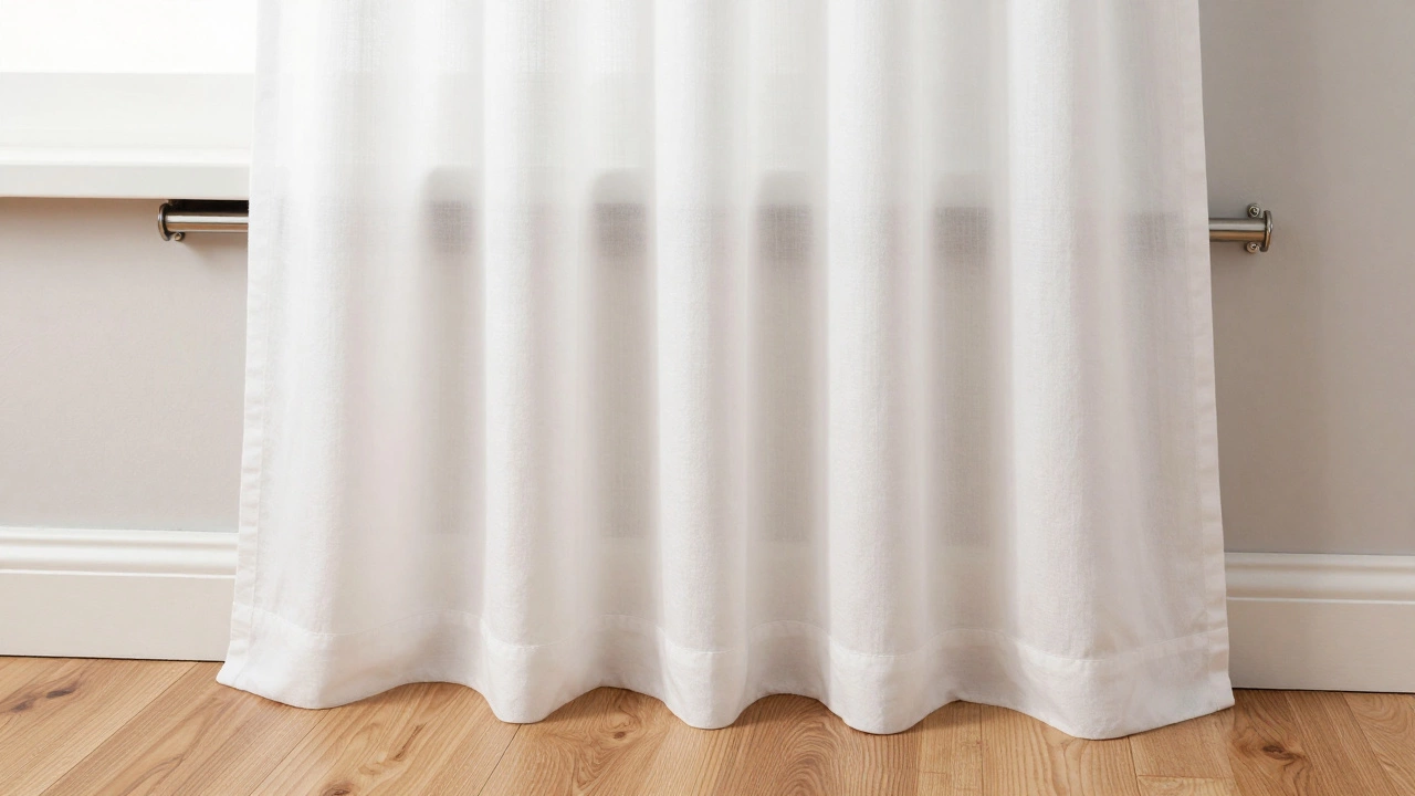 Close-up of curtain rod mounting and hem clearing baseboard and radiator